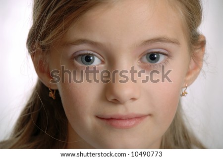  Portrait of child with inquisitive, amicable sight, pure grey eyes,