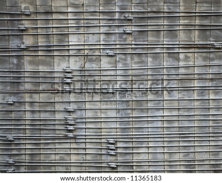 Grey concrete surface armed with metal rods