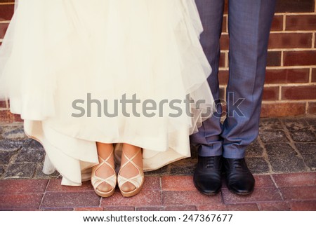 Bride and groom\'s feet on wedding day