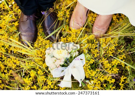 Bride and groom\'s feet on wedding day