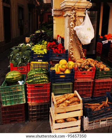 Colorful fruit and vegetables in crates on the street corner in Corfu, Greece.