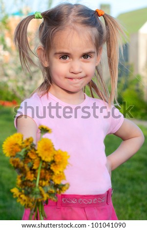 Happy cute little girl  giving flowers to you spring outdoor portrait