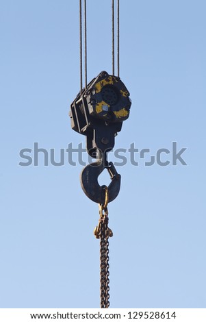 Truck crane hook with the chain suspended on it