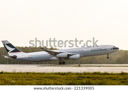 DOMODEDOVO AIRPORT (DME), RUSSIA, SEPTEMBER 26, 2014: Airbus A340 Cathay Pacific airlines taking off from Domodedovo Airport September 26, 2014 in Moscow region, Russia