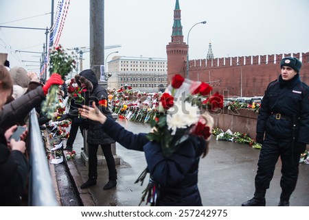 MOSCOW, RUSSIA, MARCH 1, 2015: The Russian people bear flowers into the murder place of the Russian politician Boris Nemtsov on March 1, 2015 in Moscow, Russia.
