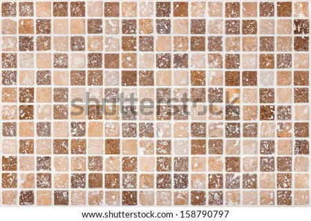 Ceramic tile background. Brown and beige square tiles.