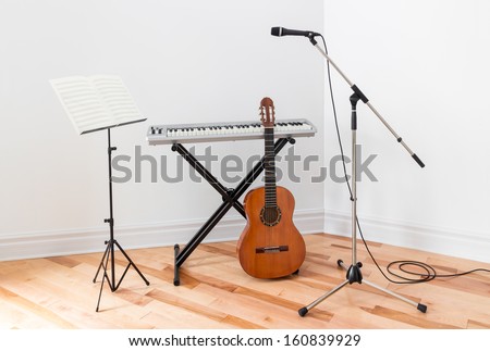 Musical Instruments In A Room. Electric Piano, Guitar, Microphone And Stand With Sheet Music.