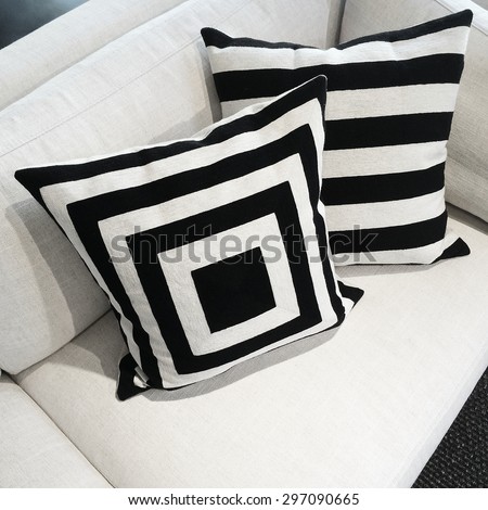 Black and white cushions on a sofa. Modern furniture.
