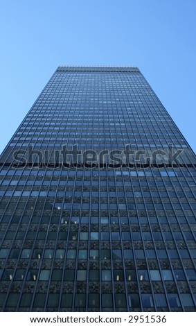 High-rise rectangular building, view from below.