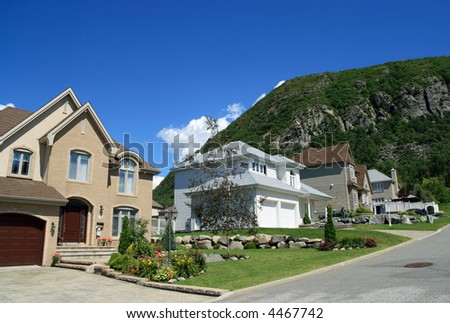 New houses in a rich suburban neighborhood near the mountain.