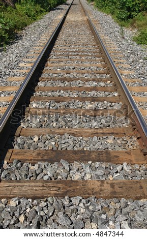 One-way railway track fading into the distance.