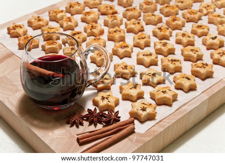 Freshly baked homemade cheese cookies and hot red wine with spices.
