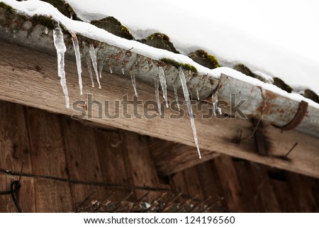 Snow, Icicles and Ice Dam on Roof & Gutter