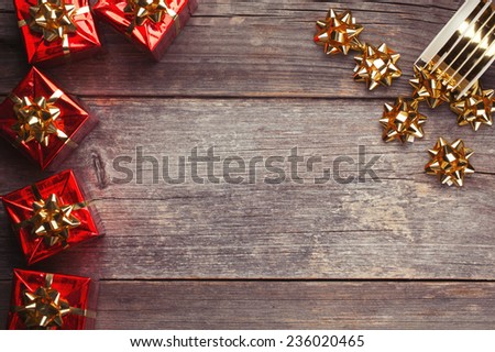 Christmas Red Gift Boxes with ribbon on rustic wood board
