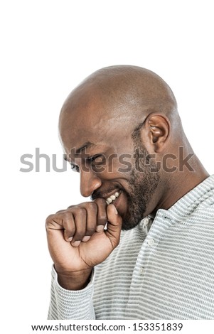 Side view of a handsome late 20s black man laughing isolated on a white background