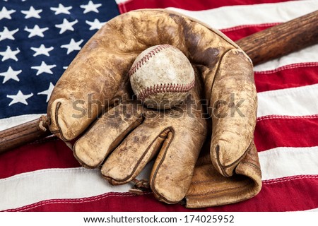 Vintage baseball, bat and glove on an American flag