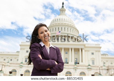 Confident business woman in front of United States capitol building in Washington DC