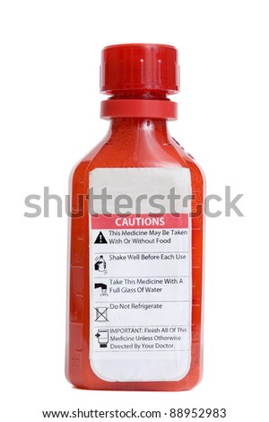Red bottle of medicine with warning label isolated on a white background