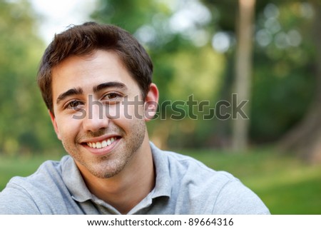 Young man outdoors portrait with copy space