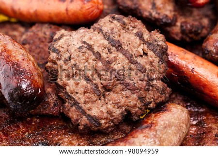 Grilled hamburger patties, hot dogs, bratwurst and steak