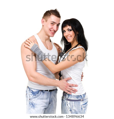 young fitness couple wearing jeans in the studio. isolated on white background. fitness gym concept