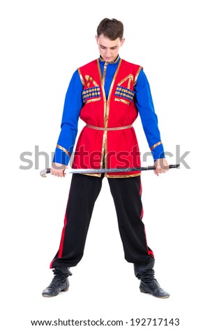 Russian cossack dance. Young dancer in ethnic clothes  posing with sword,  full length portrait isolated over white background