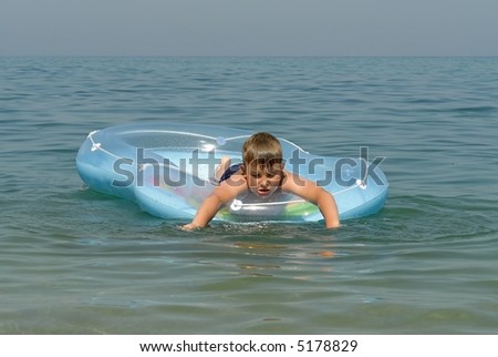 the little boy in an inflatable boat