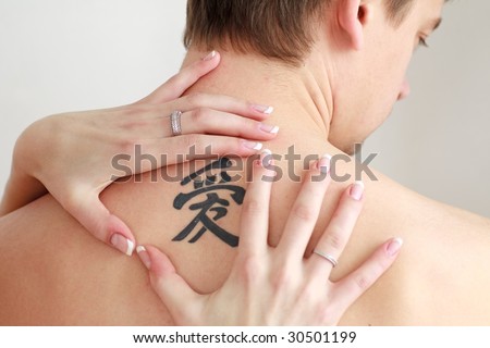 stock photo Men's back with a big tattoo