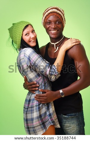 stock-photo-happy-couple-white-woman-and-black-man-on-a-green-background-35188744.jpg