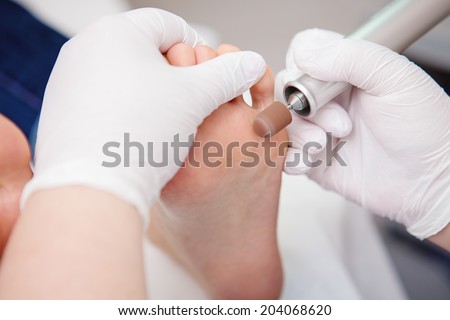 podiatrist chiropodist cleaning womans feet toenails podiatrist chiropodist cleaning womans feet toenails