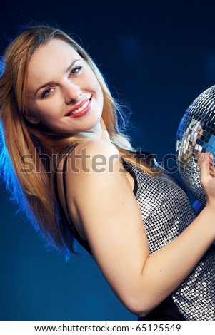 Dancing woman with disco ball