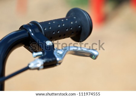 handle of a baby bike with the brake lever