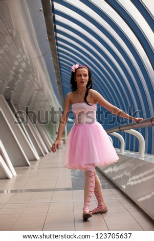 girl in a pink dress in the glass gallery