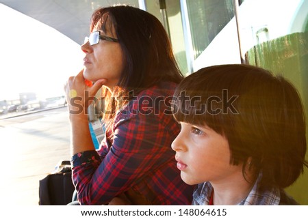 Mother and son watching on sunset
