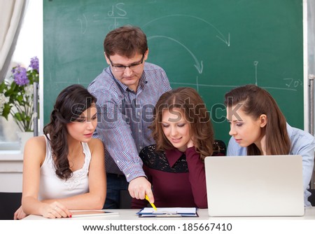 Teacher in training class with students