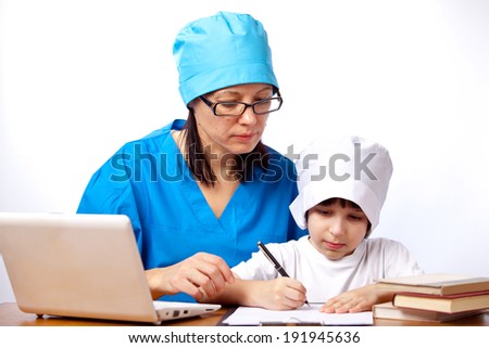 mom and son doctors write prescriptions