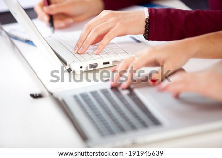 Hands of an student typing on laptop