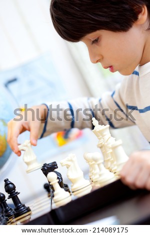 boy playing a game of chess, the development of logical thinking