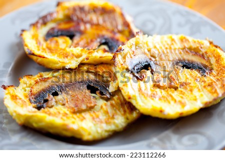 Turkey cutlets with mushrooms on a plate. Shallow depth of field