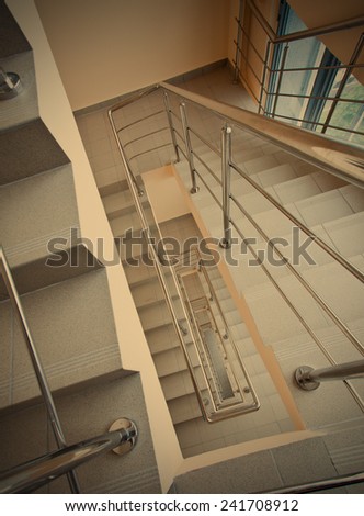 emergency exit staircase in modern office center, instagram image style