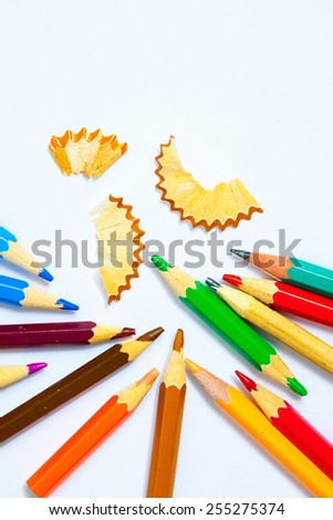 vintage colored pencils with chips on white background