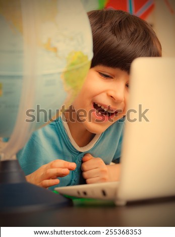 smiling child on a geography lesson. instagram image retro style