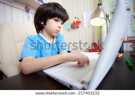 distance learning, a boy with computer in the interior