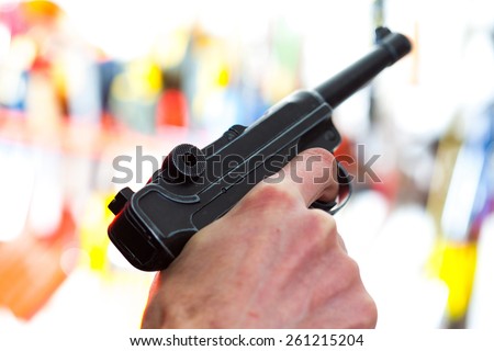 Parabellum automatic pistol in a human hand, shallow depth of field. close-up