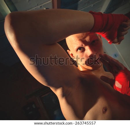 fighter demonstrates the protective block and punch. instagram image retro style