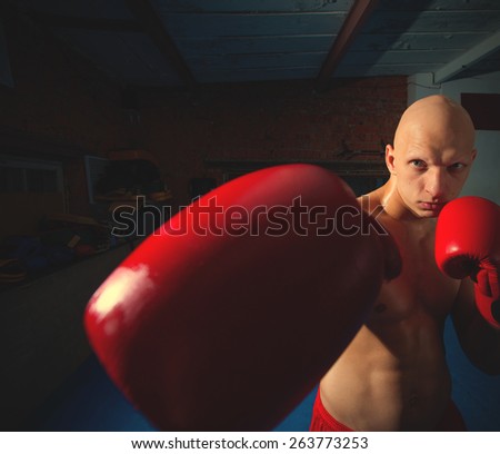 young boxer in red gloves in the gym. instagram image retro style