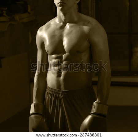 Muscle torso of a boxer. monochrome retro image