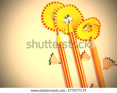 three pencil flowers on backdrop with copy space. instagram image retro style