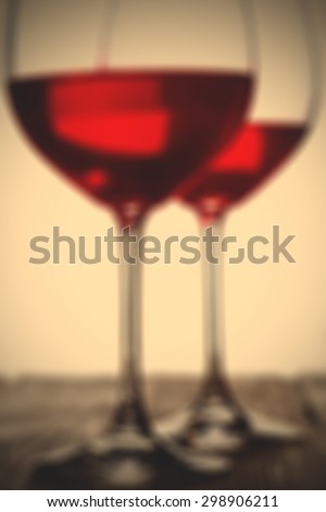 red wine in goblets. romantic blur effect. instagram image filter retro style