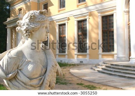 Fragment of the Antique Sculpture, Feminine Figure on Background of the Building with Pillar